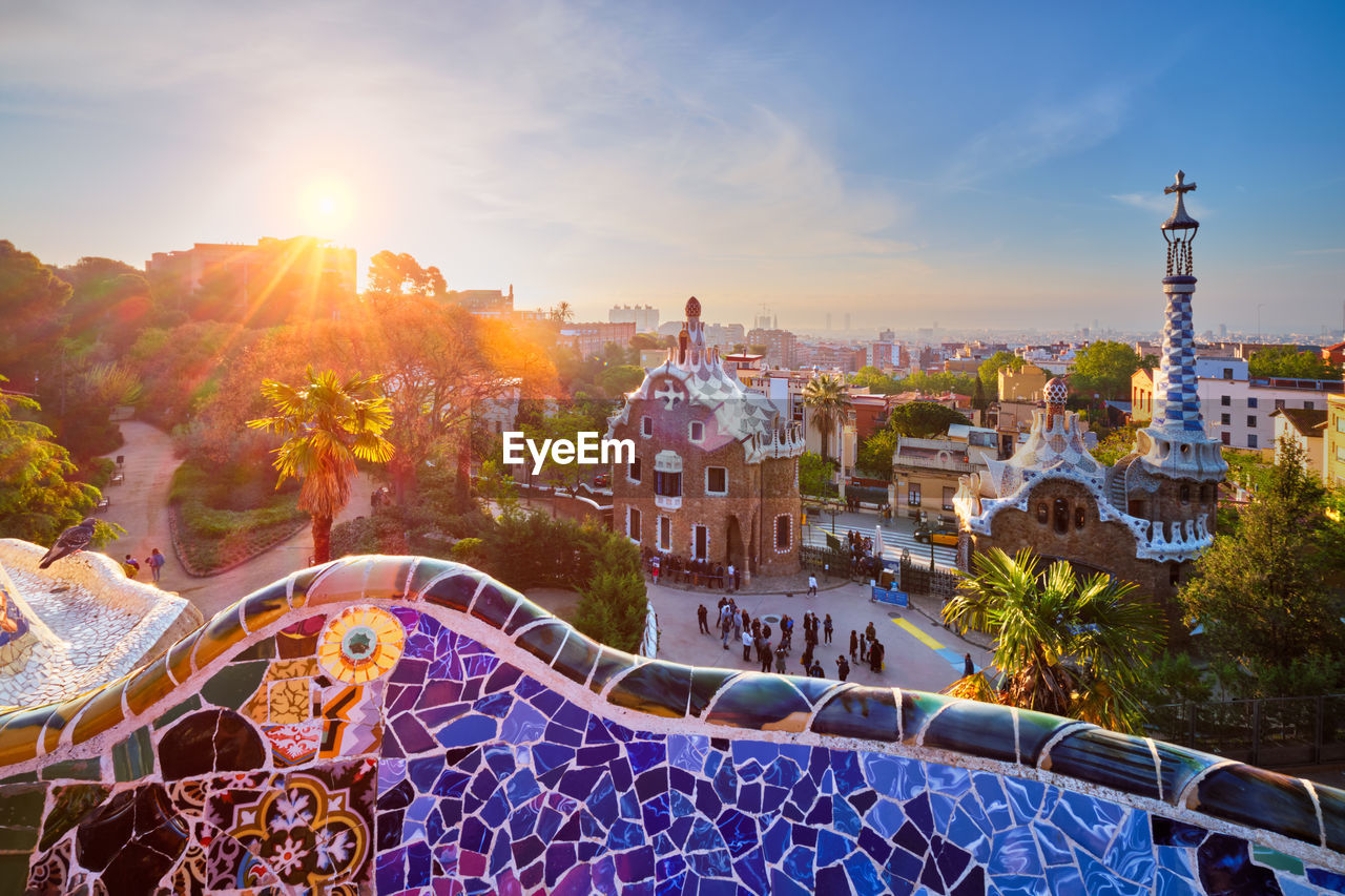 Barcelona city view from guell park. sunrise view of colorful mosaic building in park guell