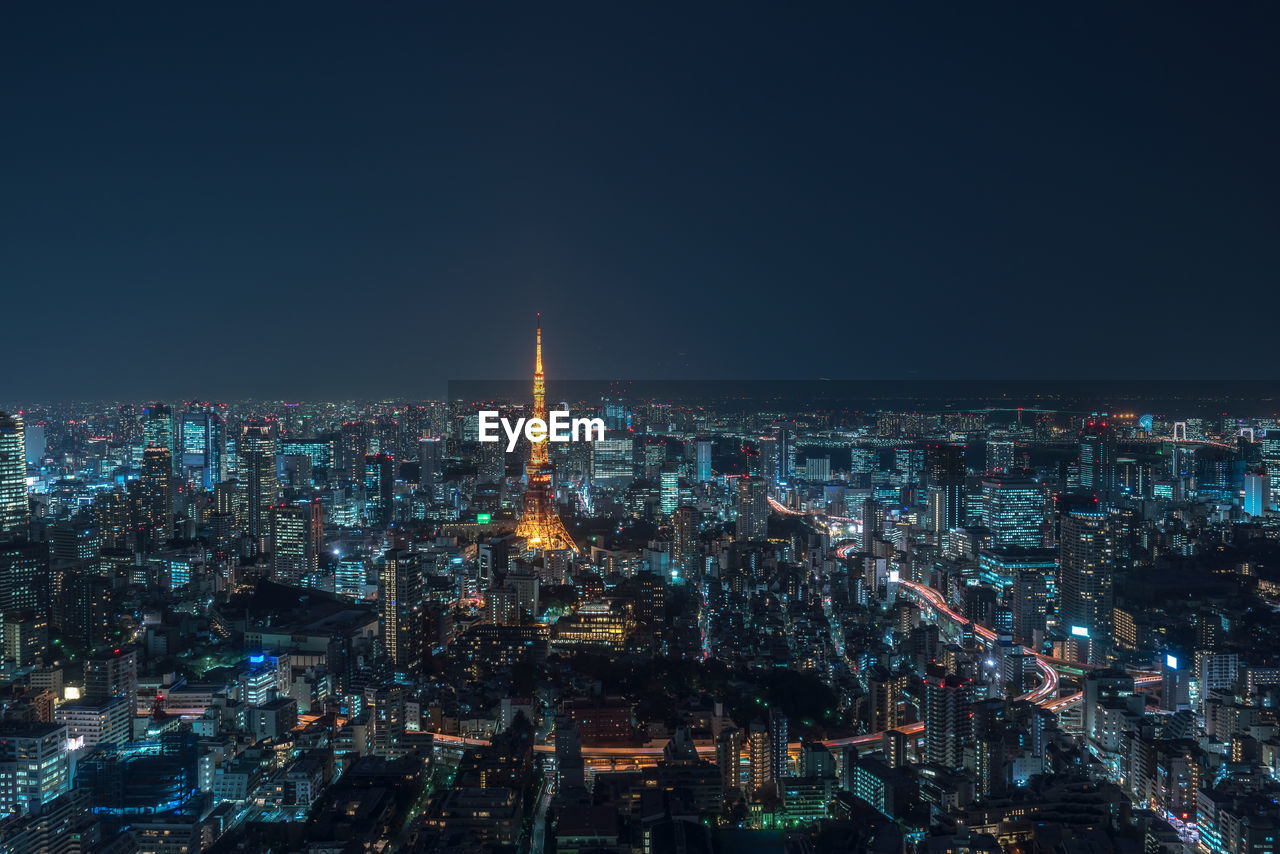 AERIAL VIEW OF ILLUMINATED CITY BUILDINGS