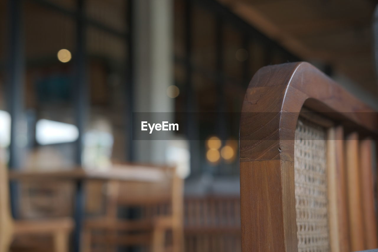 wood, focus on foreground, indoors, no people, architecture, business, selective focus, seat, book, interior design