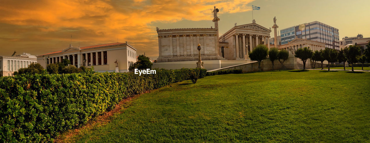 architecture, sky, built structure, sunset, building exterior, nature, plant, travel destinations, city, building, mansion, grass, cloud, travel, landscape, sunlight, environment, evening, beauty in nature, estate, cityscape, tourism, house, history, outdoors, the past, tree, government, residential district, no people, home, garden, panoramic, front or back yard, land, dusk, twilight, scenics - nature, field, lawn, summer, politics and government, politics