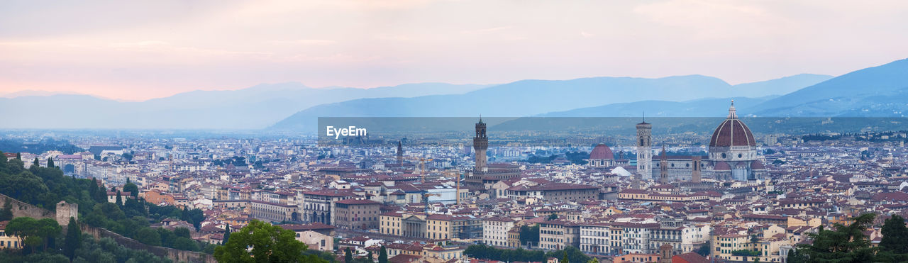 Aerial view of townscape against sky during sunset