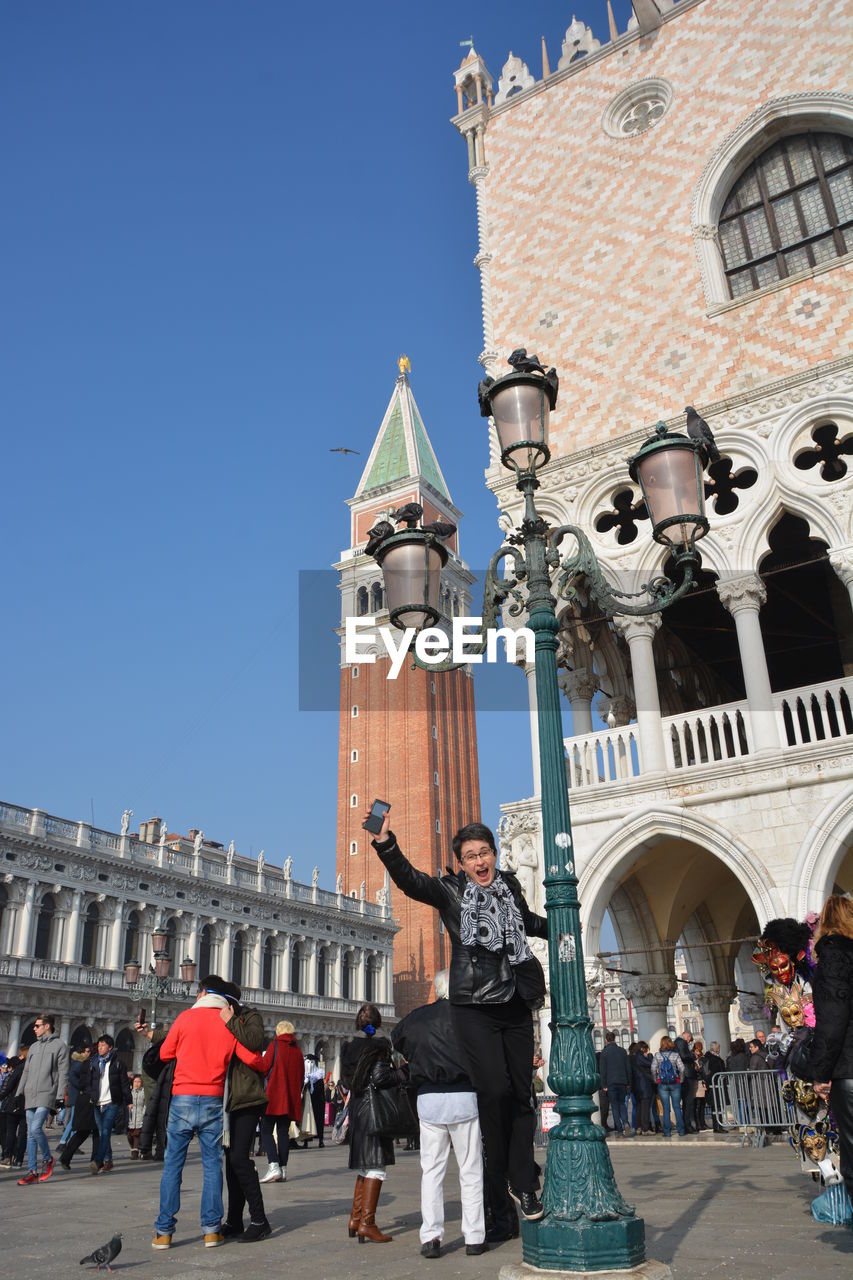 LOW ANGLE VIEW OF STATUE IN CITY