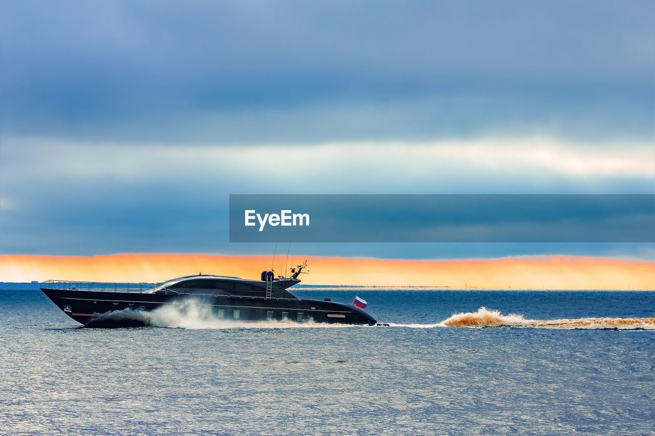 NAUTICAL VESSEL ON SEA AGAINST SKY