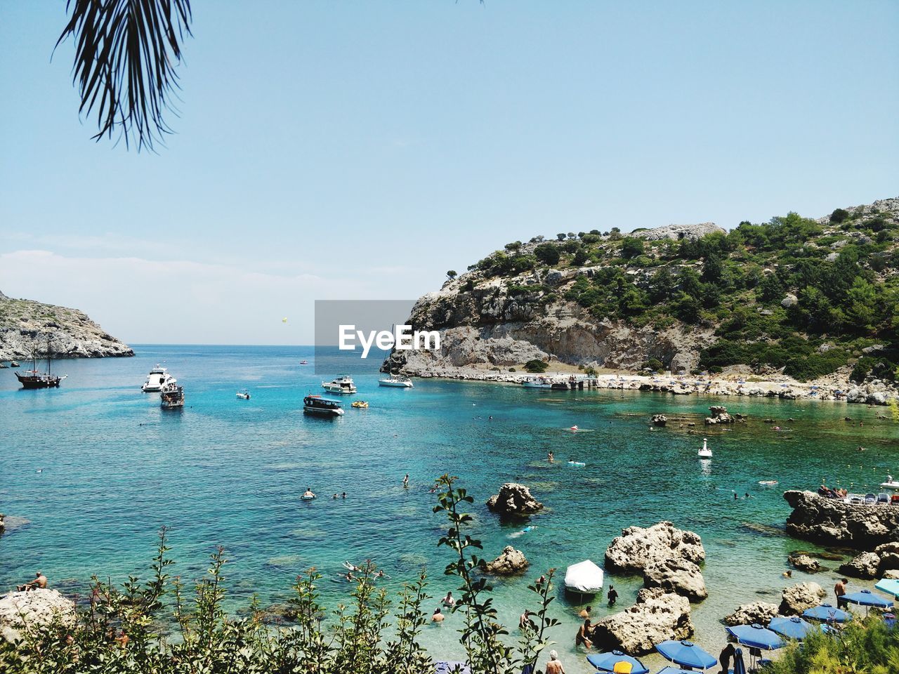 Scenic view of sea against blue sky