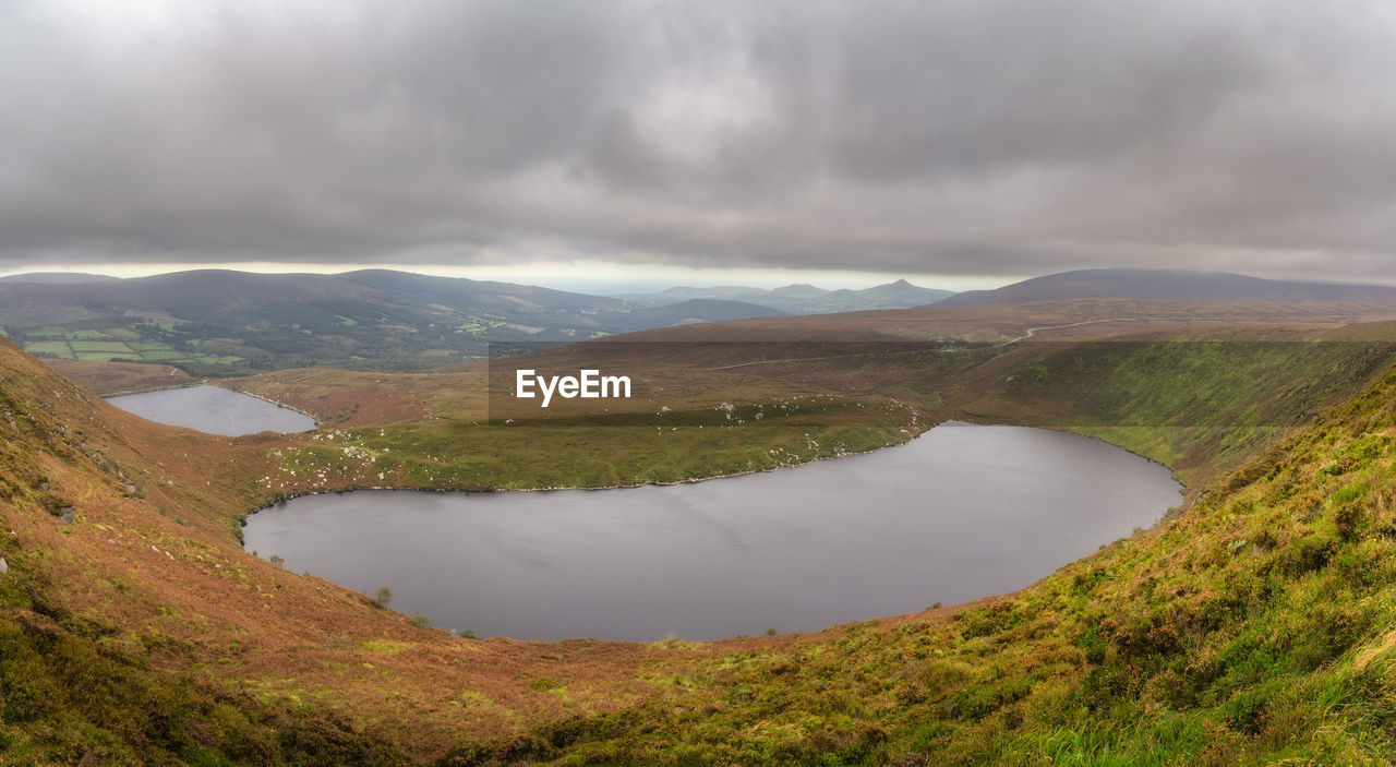 Panoramic view on upper and lower lakes lough bray sugarloaf and mountain range in wicklow mountains