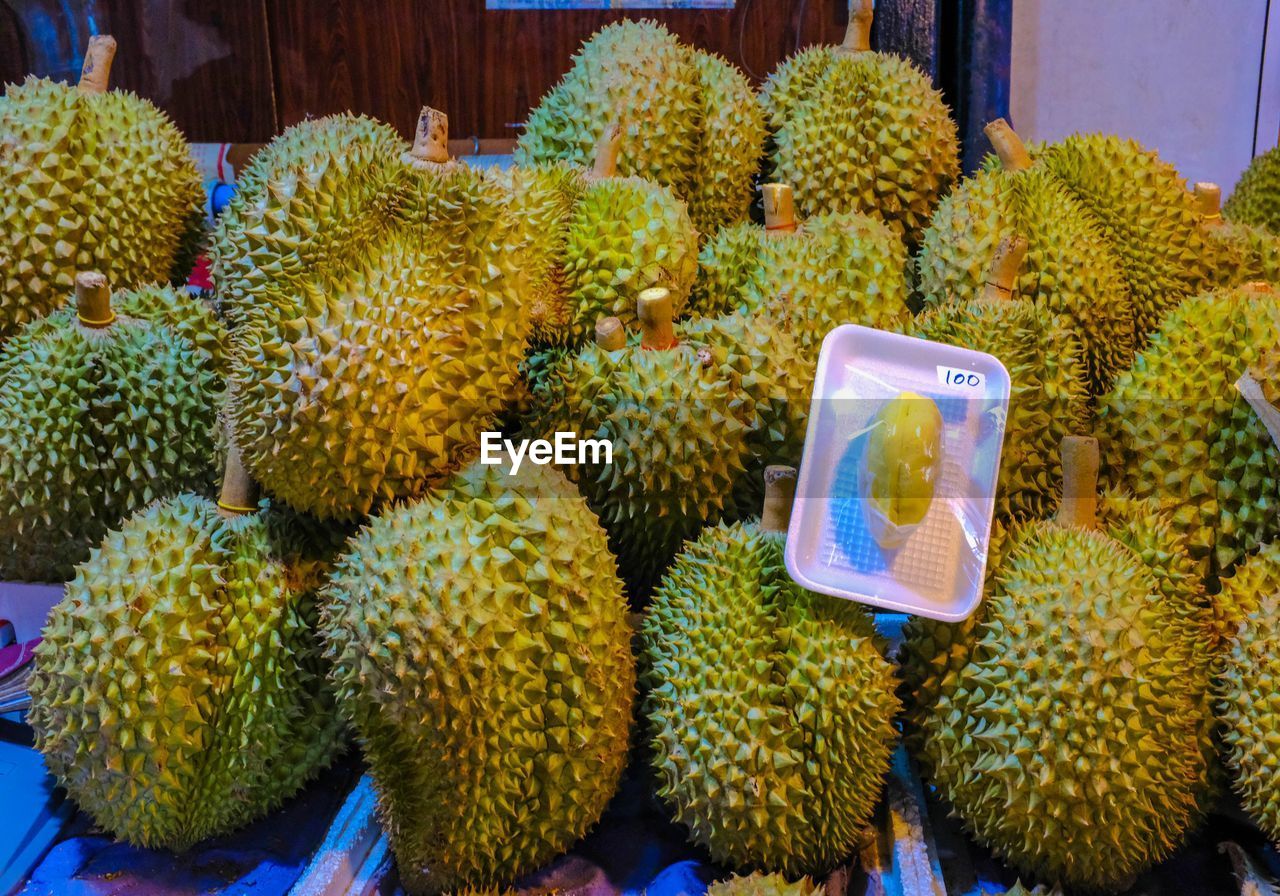 CLOSE-UP OF FRUITS IN MARKET FOR SALE