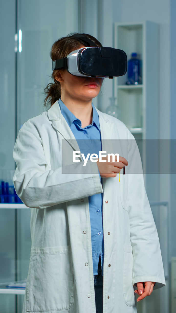 Doctor using virtual reality simulator at hospital