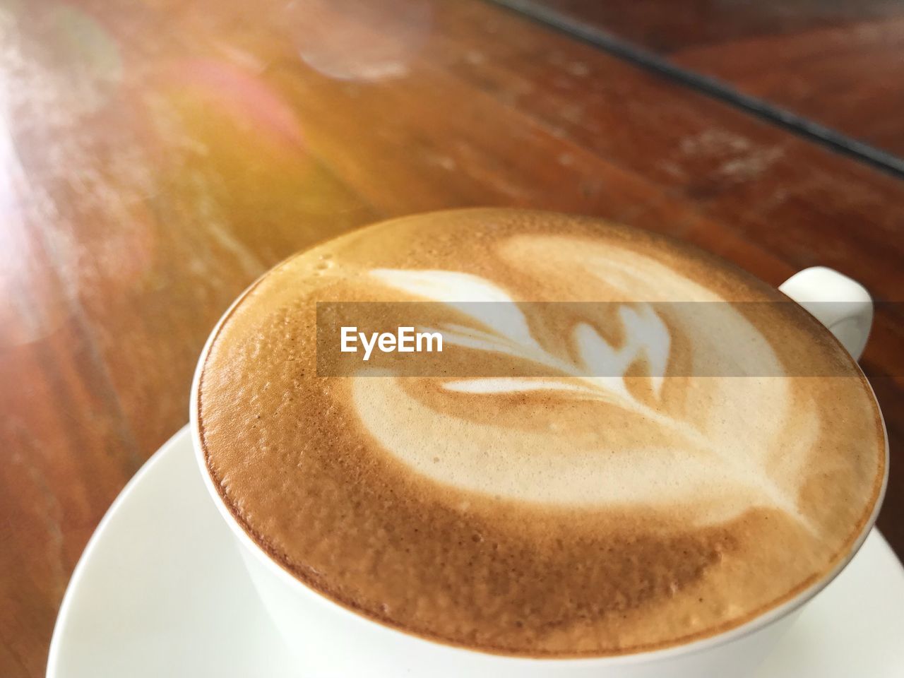CLOSE-UP OF COFFEE IN CUP ON TABLE