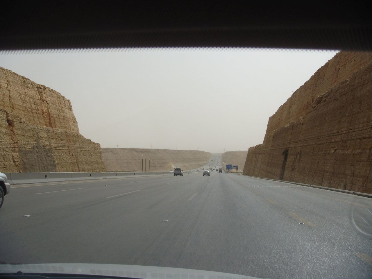 Cars on road against clear sky