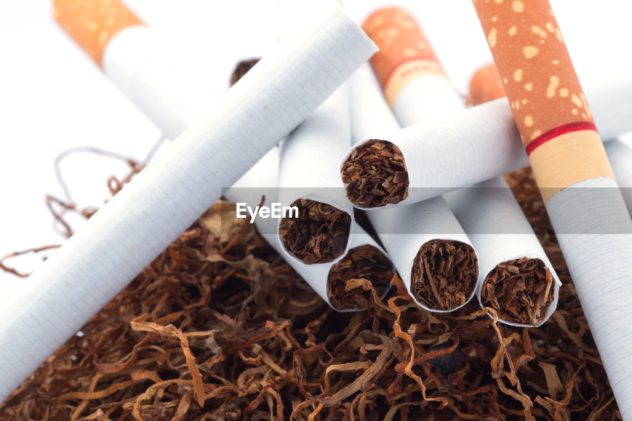 HIGH ANGLE VIEW OF CIGARETTE IN CONTAINER ON FLOOR