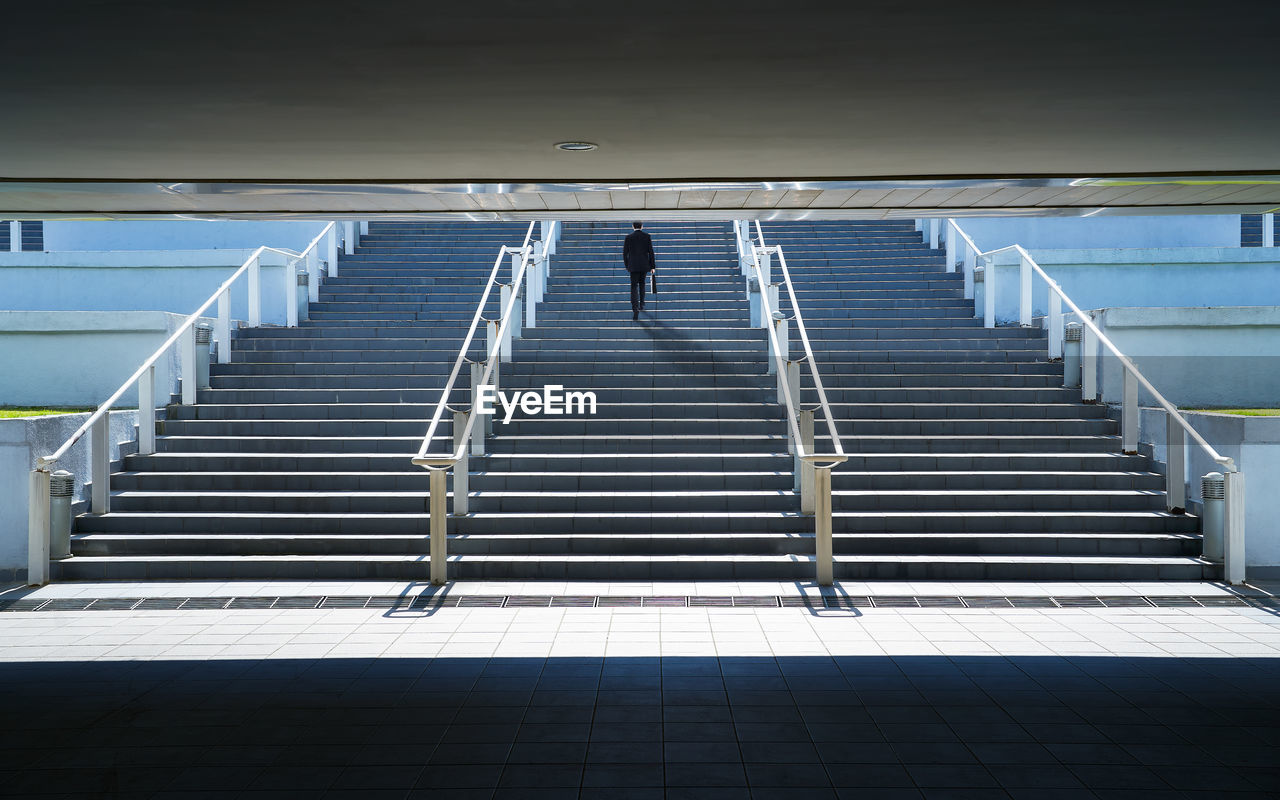 Man walking on staircase