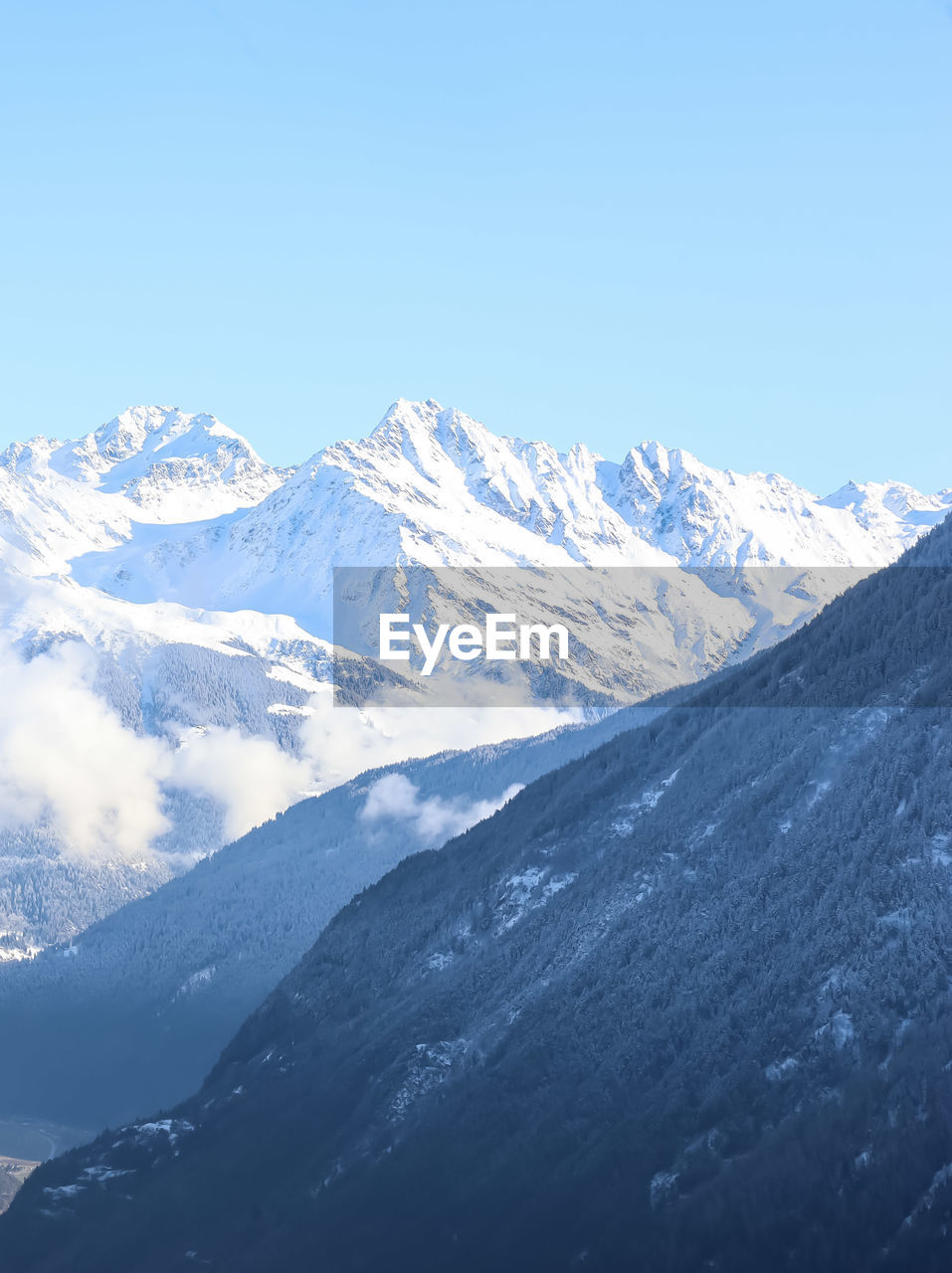 Scenic view of snowcapped mountains against clear sky at martigny in switzerland  