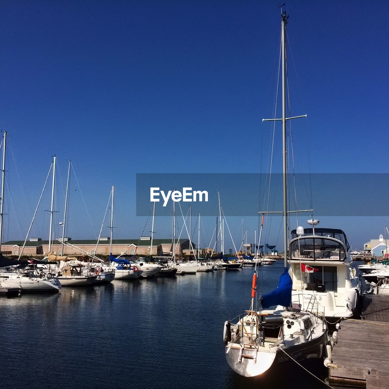 BOATS MOORED IN SEA