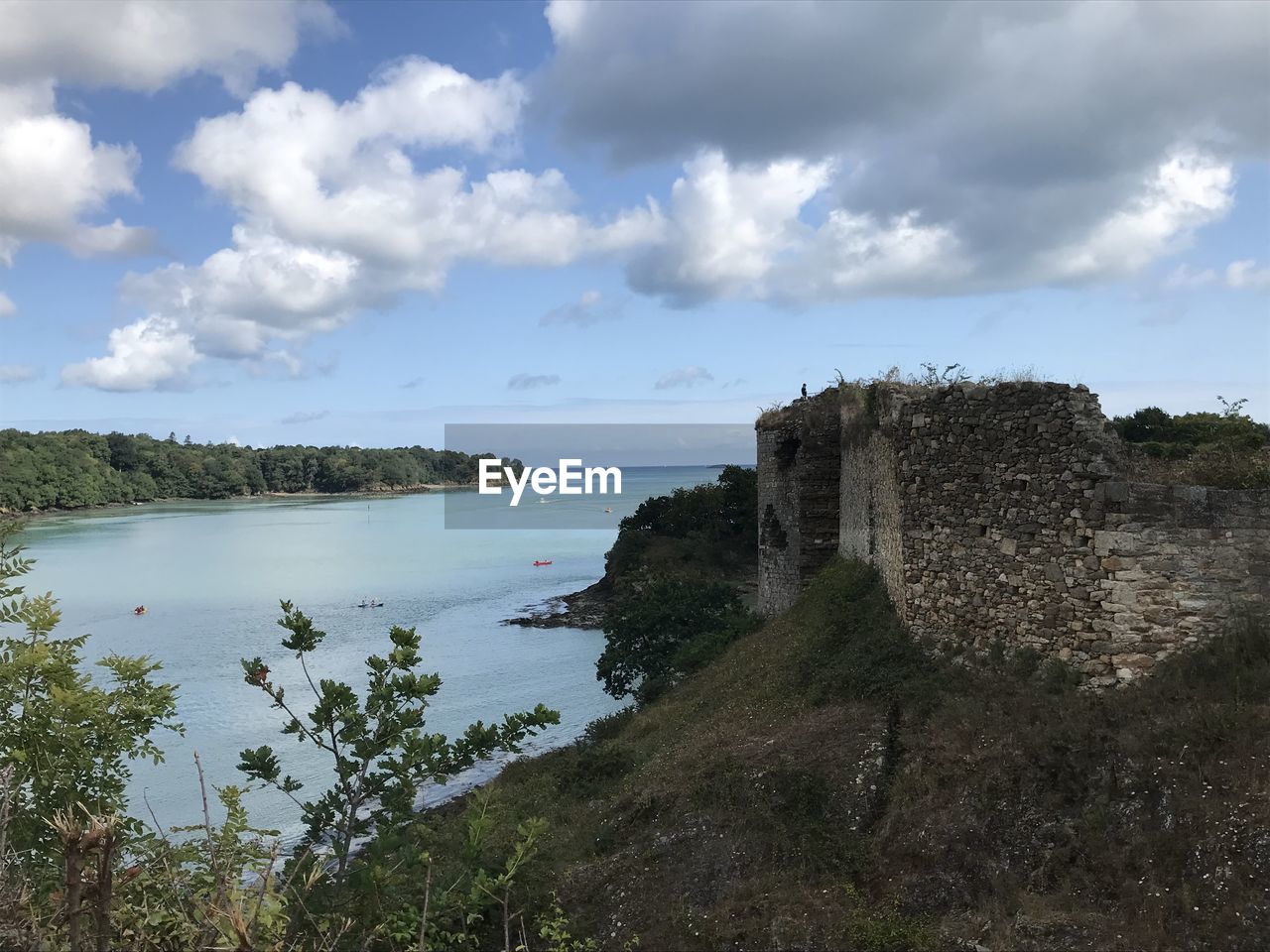 CASTLE BY SEA AGAINST SKY