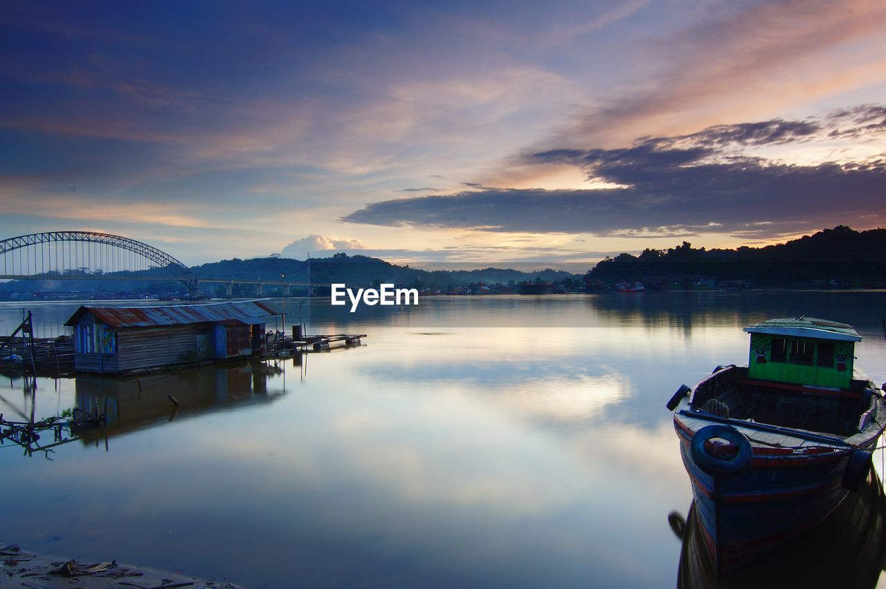 VIEW OF BOATS IN CALM LAKE