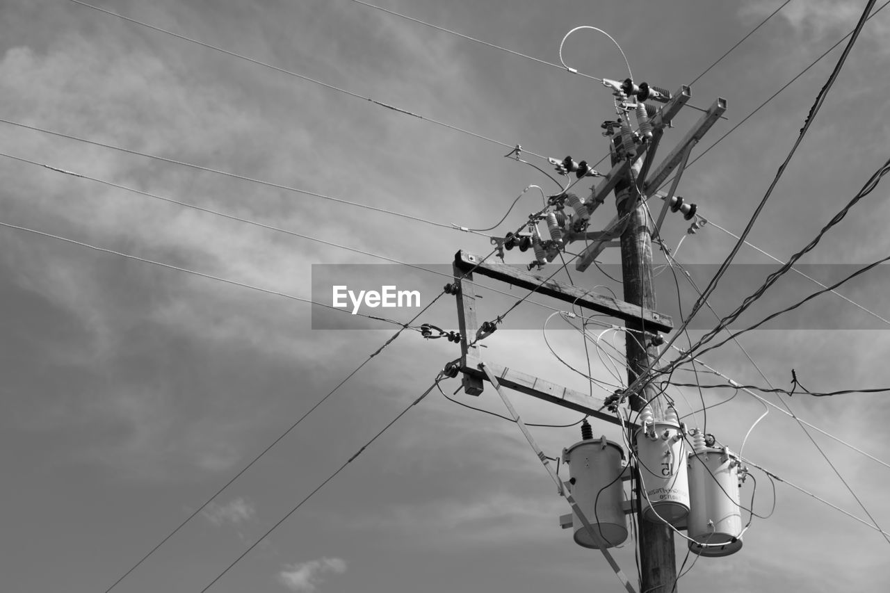 LOW ANGLE VIEW OF POWER LINE AGAINST SKY