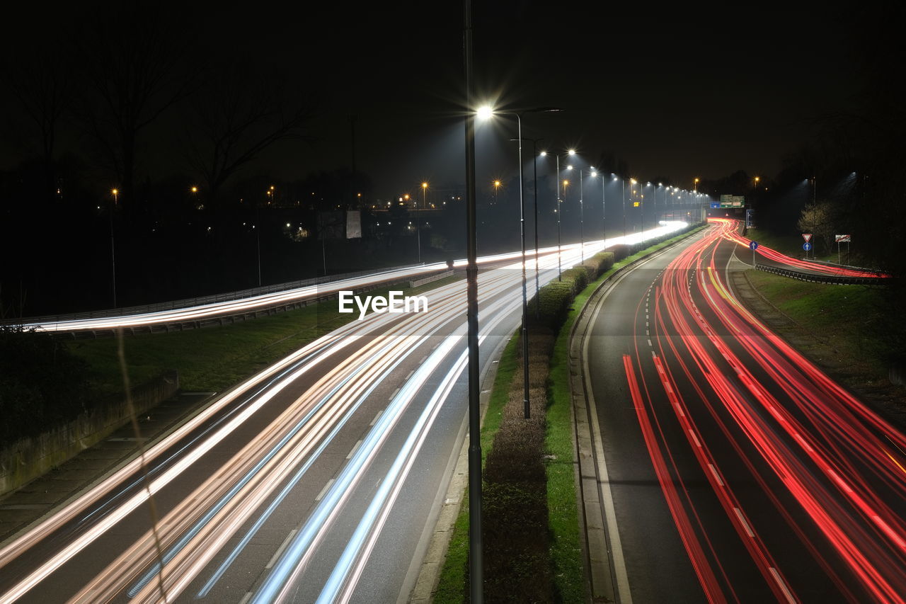 High angle view of light trails on city street at night