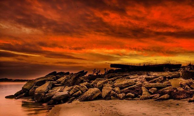 SCENIC VIEW OF SEA AT SUNSET