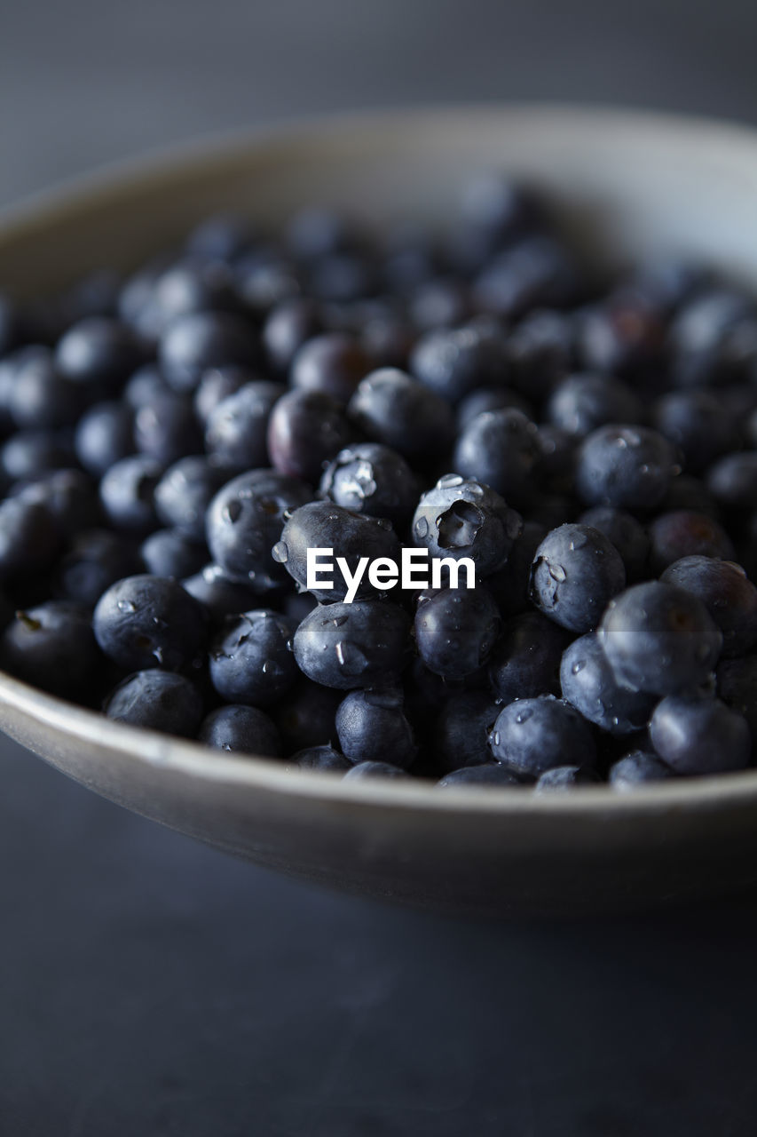 Blueberries in bowl with water droplets detail