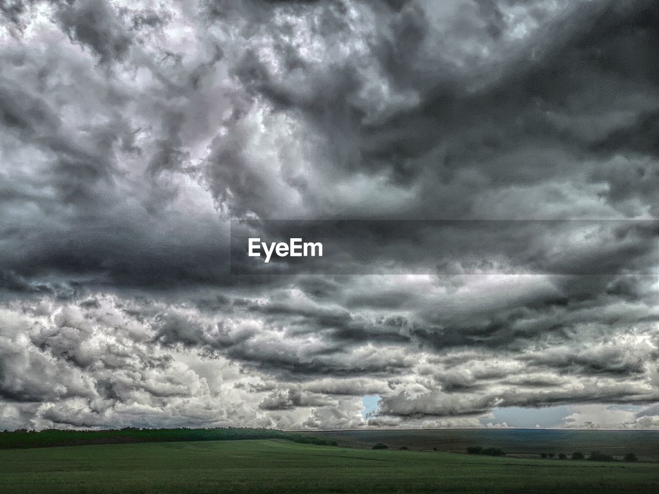 sky, cloud, storm, environment, storm cloud, thunderstorm, dramatic sky, landscape, nature, cloudscape, beauty in nature, overcast, scenics - nature, rain, no people, land, wet, plain, ominous, outdoors, grass, extreme weather, field, plant, horizon, day, dark, horizon over land, moody sky