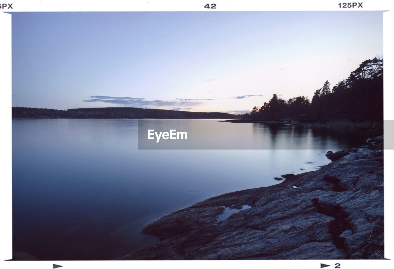 SCENIC VIEW OF CALM LAKE