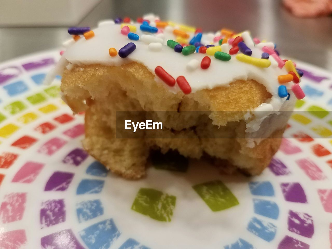 CLOSE-UP OF CAKE ON PLATE WITH FORK