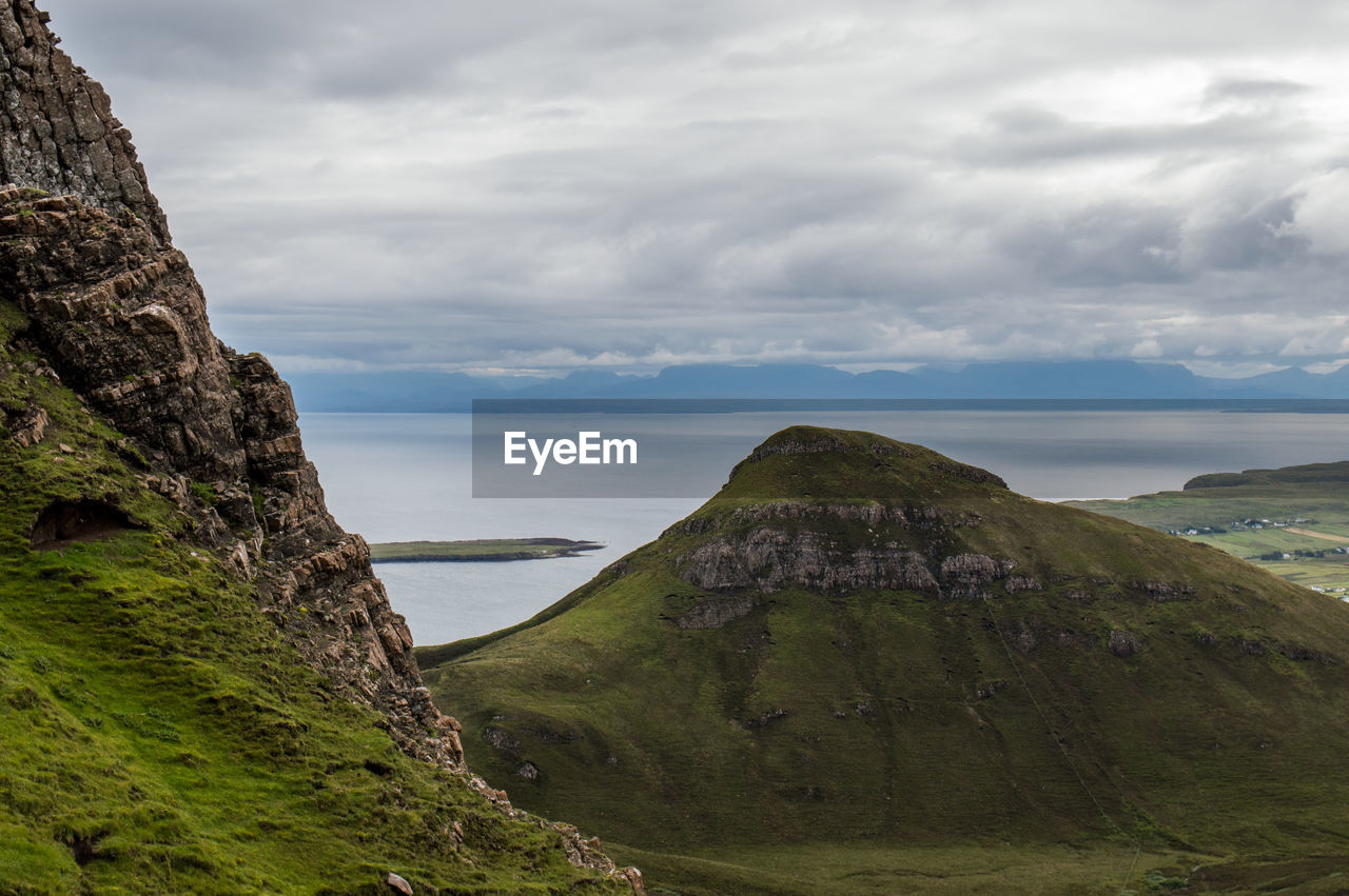 Scenic view of sea against landscape