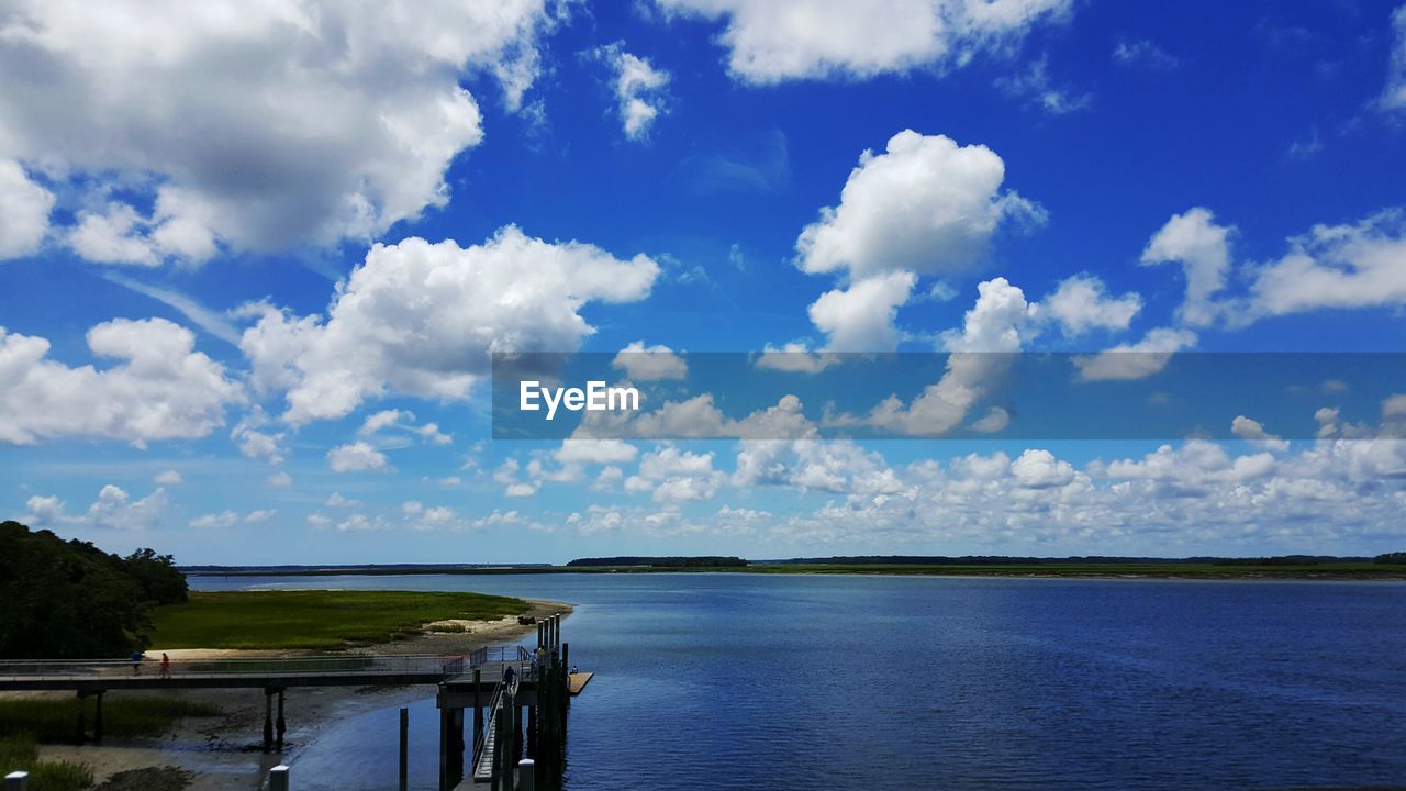 View of calm sea against cloudy sky