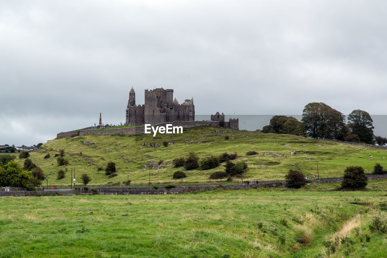VIEW OF CASTLE ON FIELD AGAINST SKY