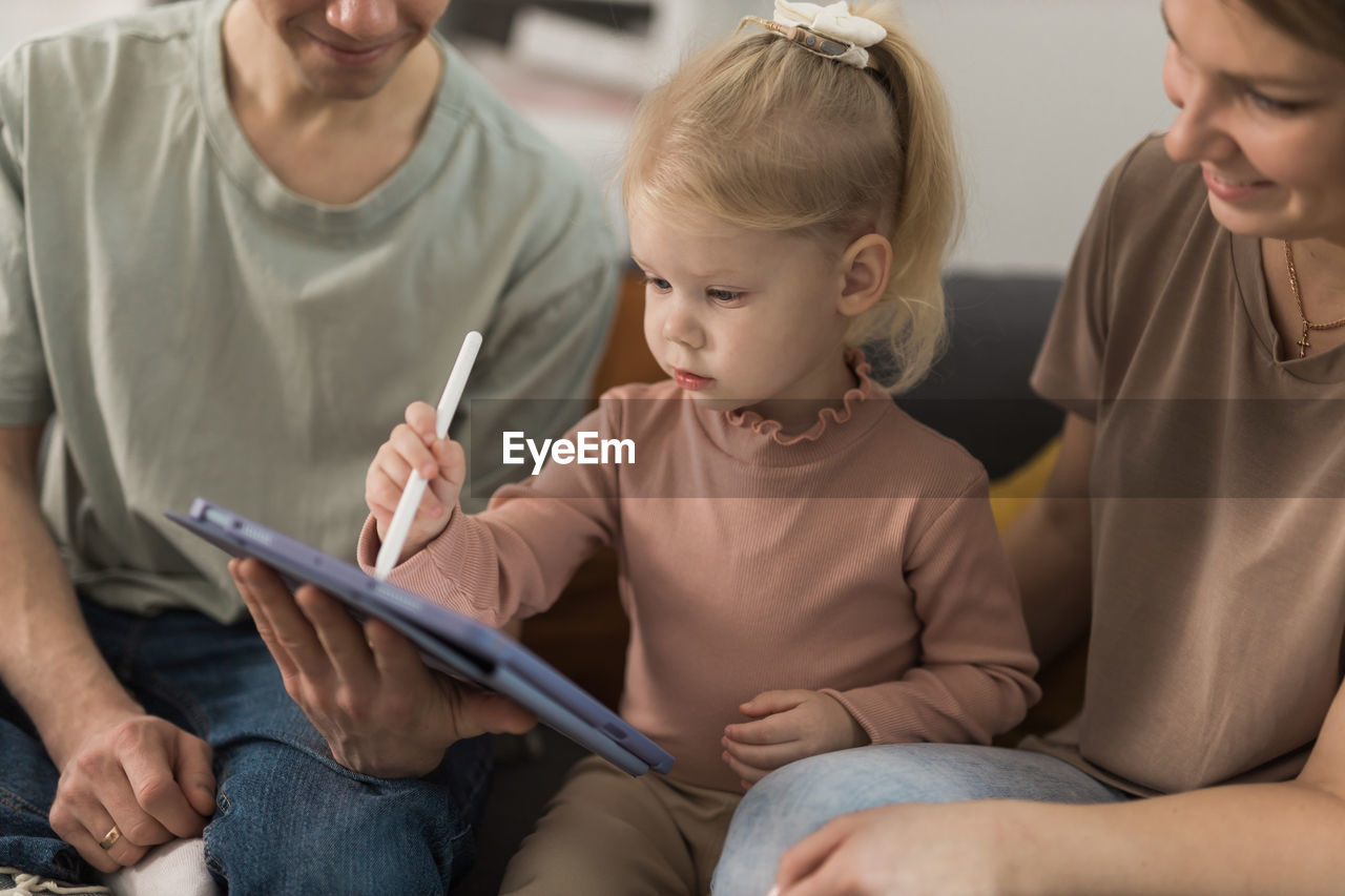 portrait of boy using digital tablet