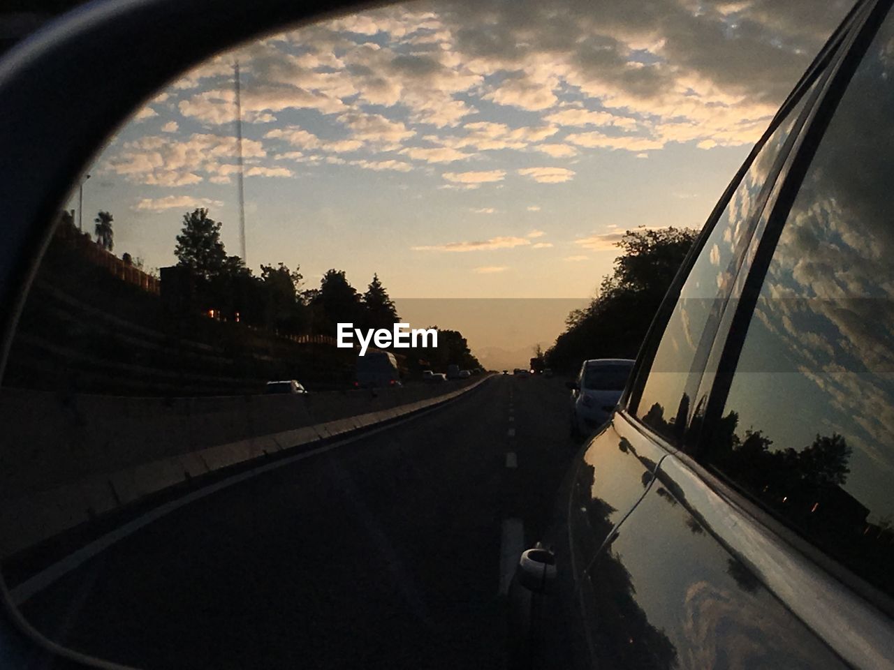 VIEW OF ROAD THROUGH CAR WINDSHIELD