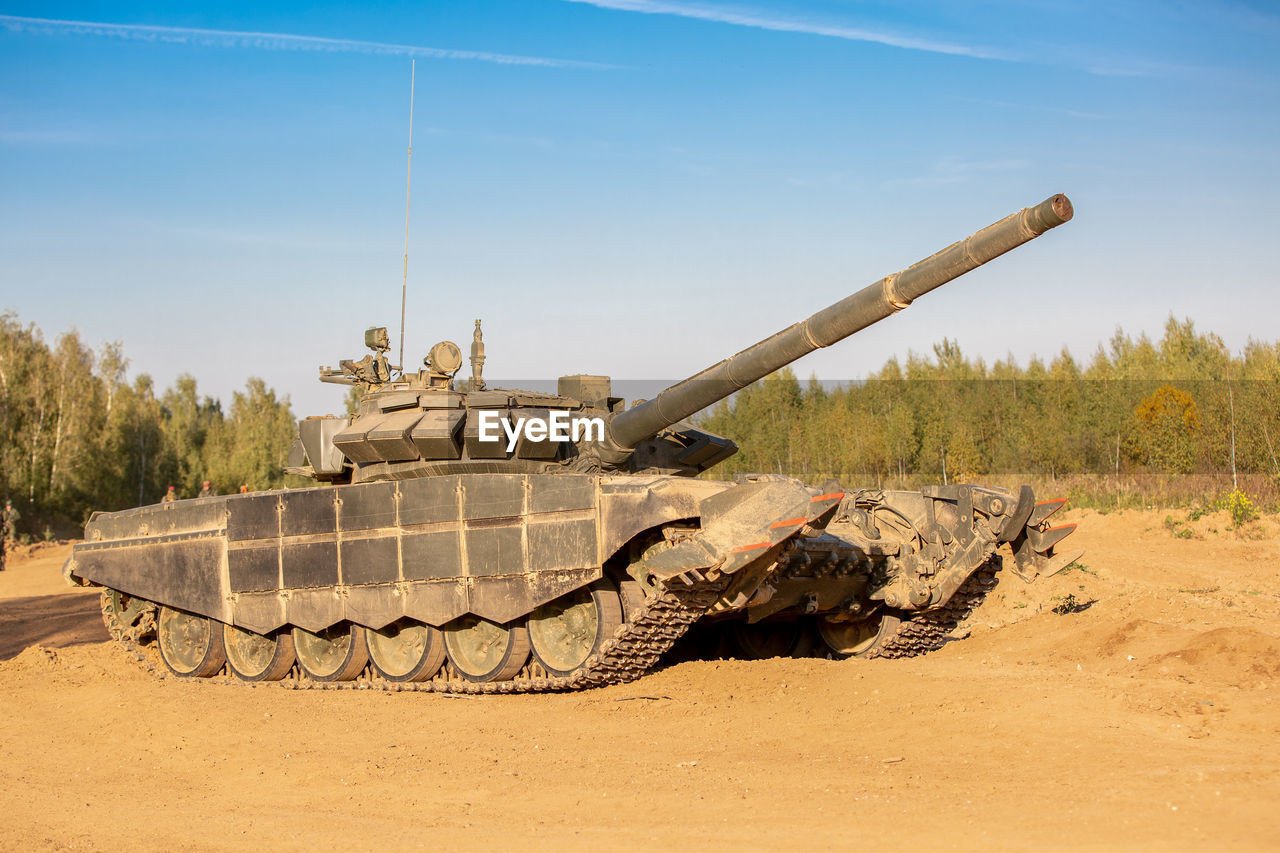 View of armored tank on land against sky