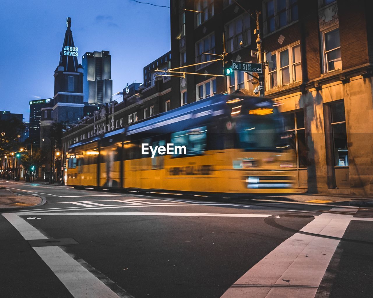 View of atlanta street and buildings at night with streetcar 