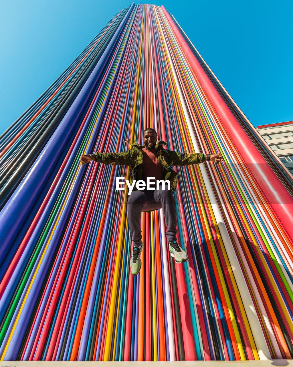 LOW ANGLE VIEW OF ILLUMINATED SCULPTURE AGAINST SKY