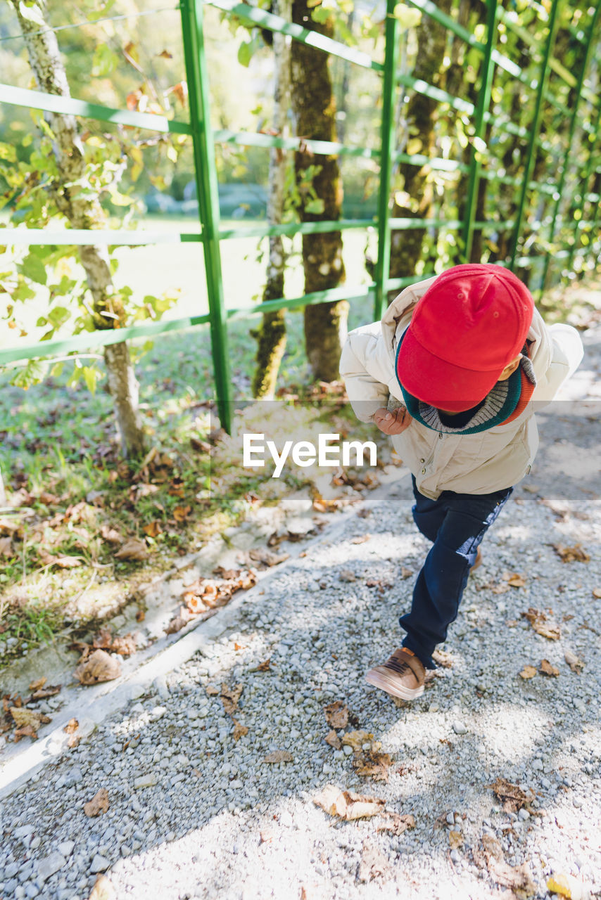 A boy running in a park