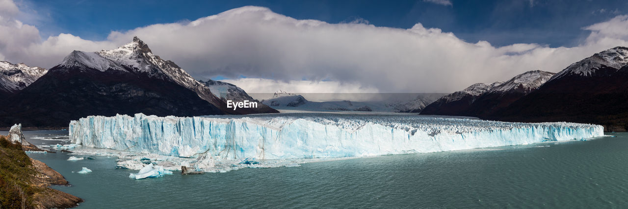 Panoramic view of glaciers against sky