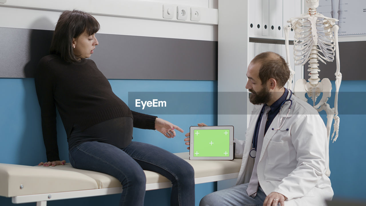 female doctor examining patient