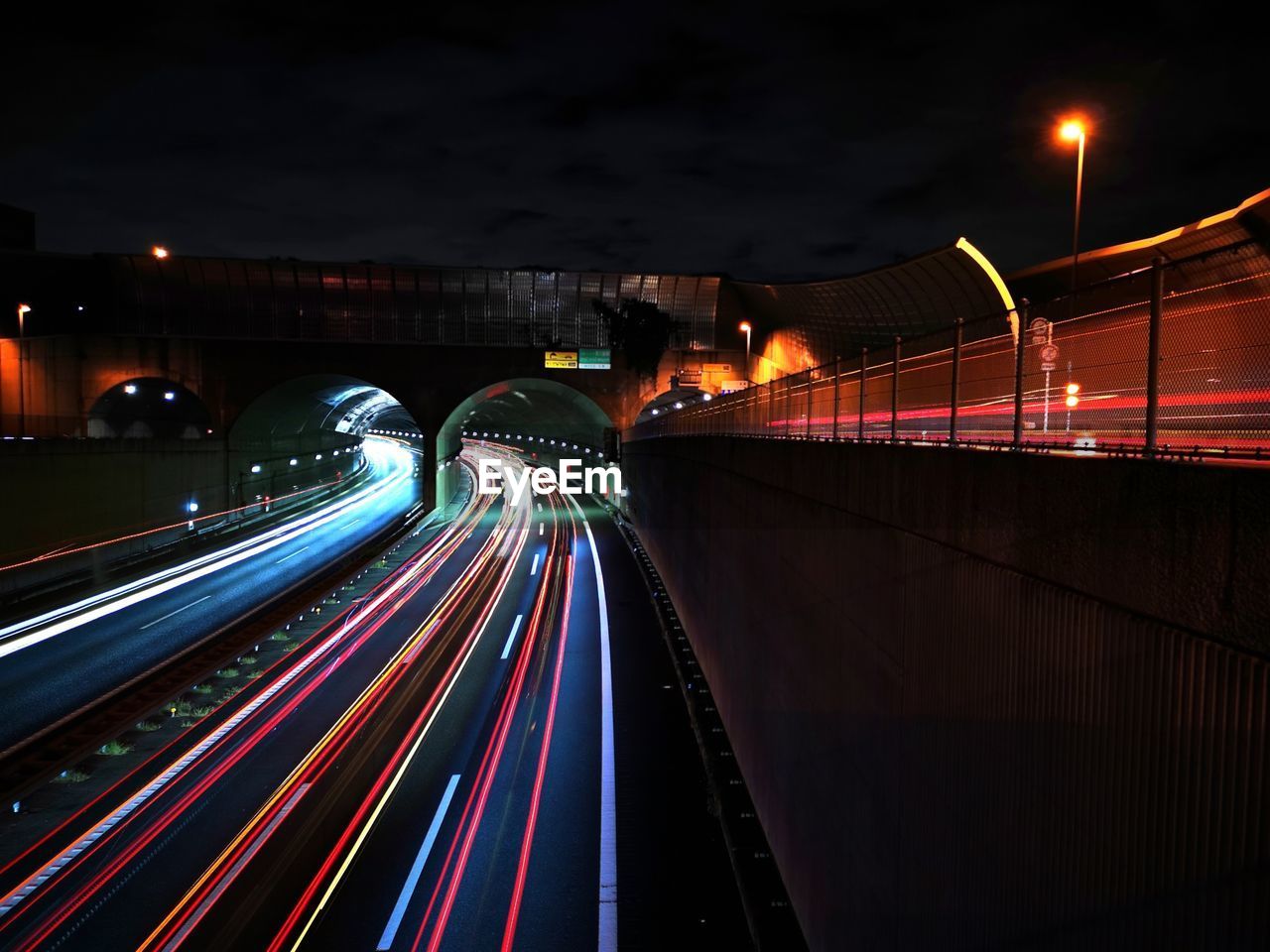 high angle view of light trails on highway at night