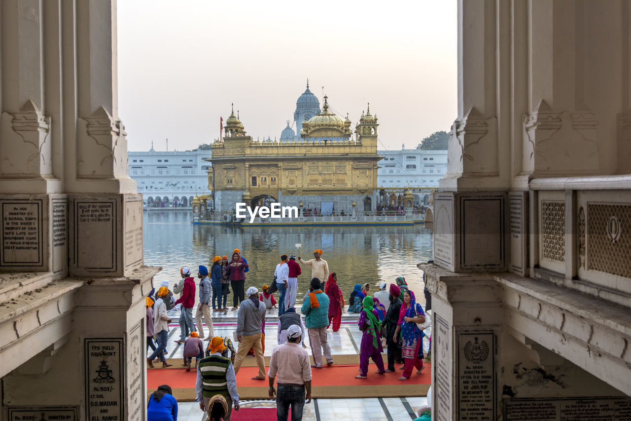 PEOPLE OUTSIDE TEMPLE