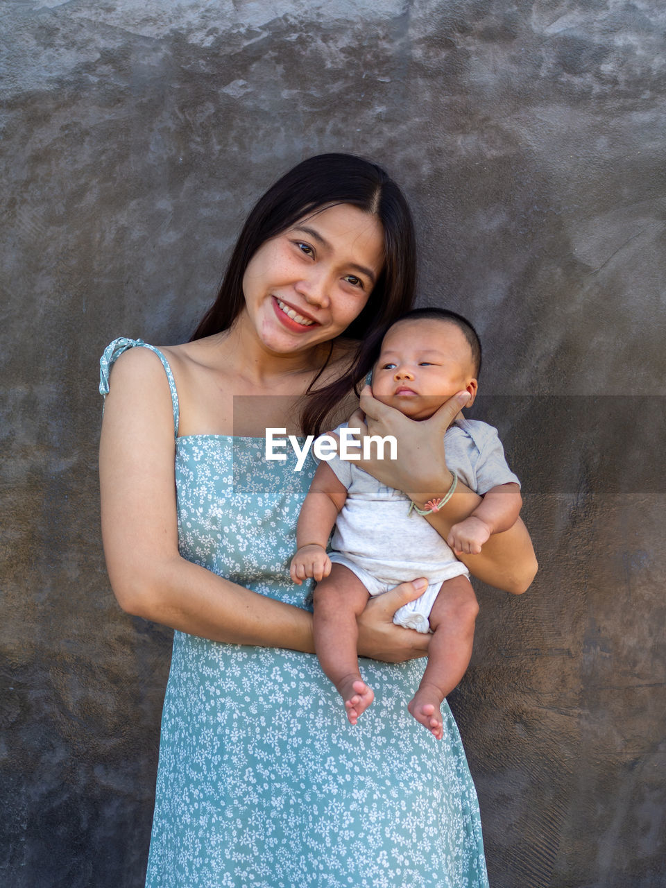 Woman and baby asian and nationality thai is happy feel