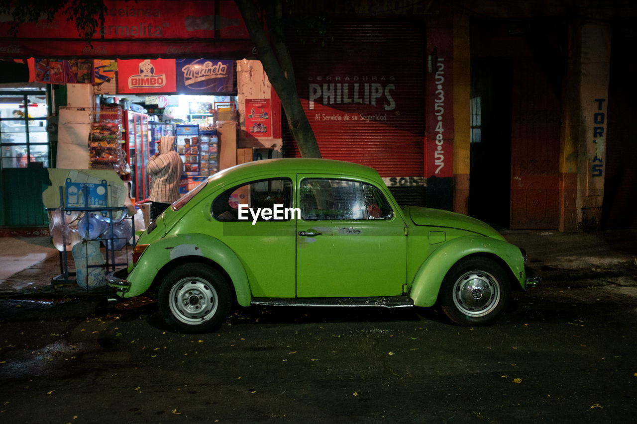 VINTAGE CAR PARKED ON STREET