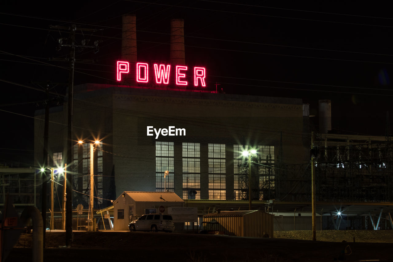 INFORMATION SIGN ON ILLUMINATED NIGHT