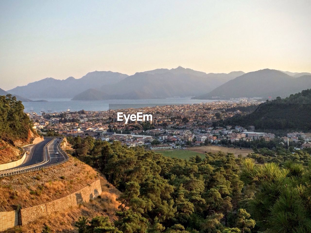 High angle view of city buildings against clear sky