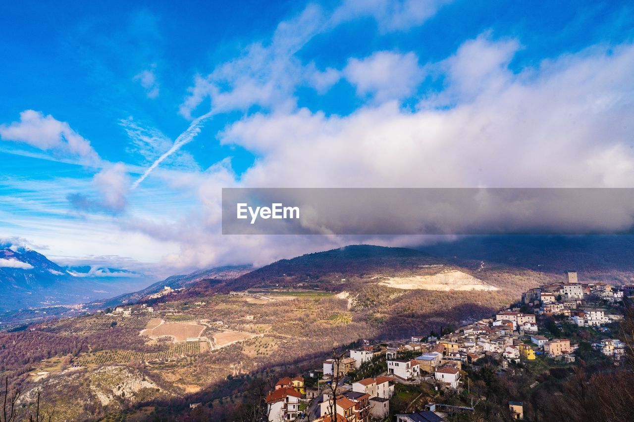 Aerial view of townscape against sky