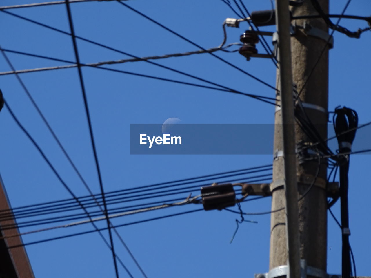 LOW ANGLE VIEW OF POWER LINES AGAINST SKY