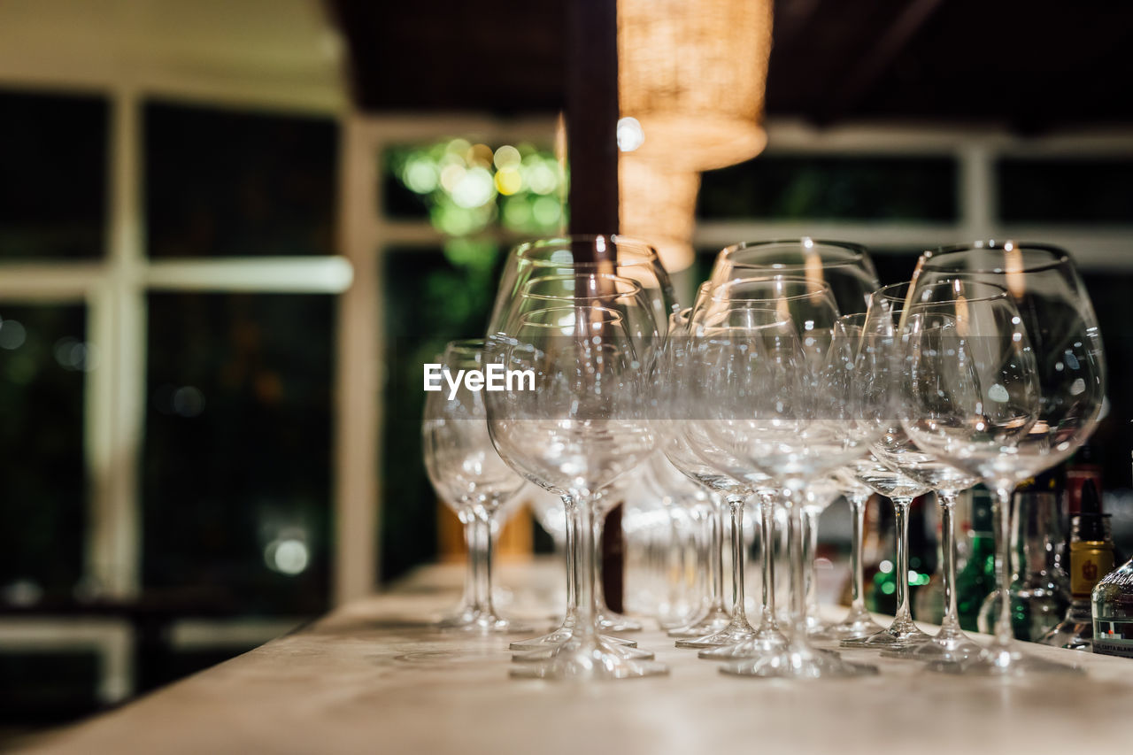 Luxury table settings for fine dining with and glassware, beautiful blurred background. 