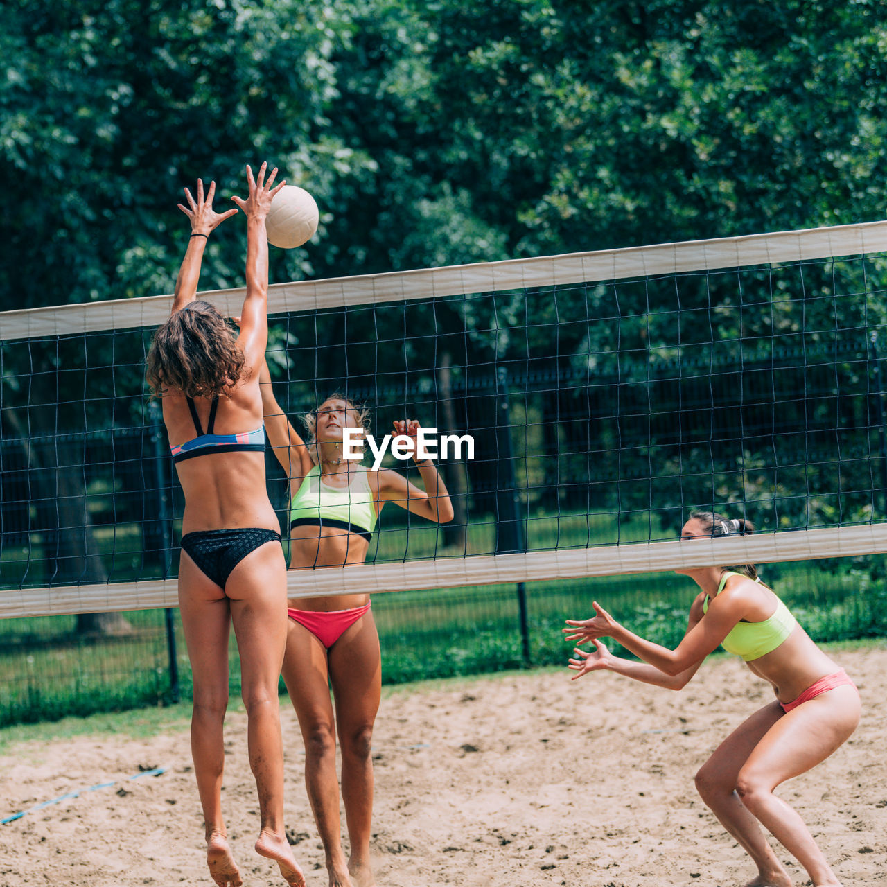 Female team playing beach volleyball