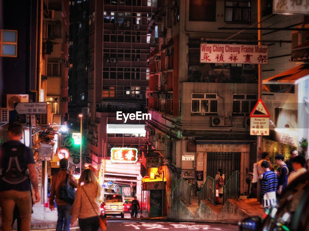 CROWD ON STREET AT NIGHT