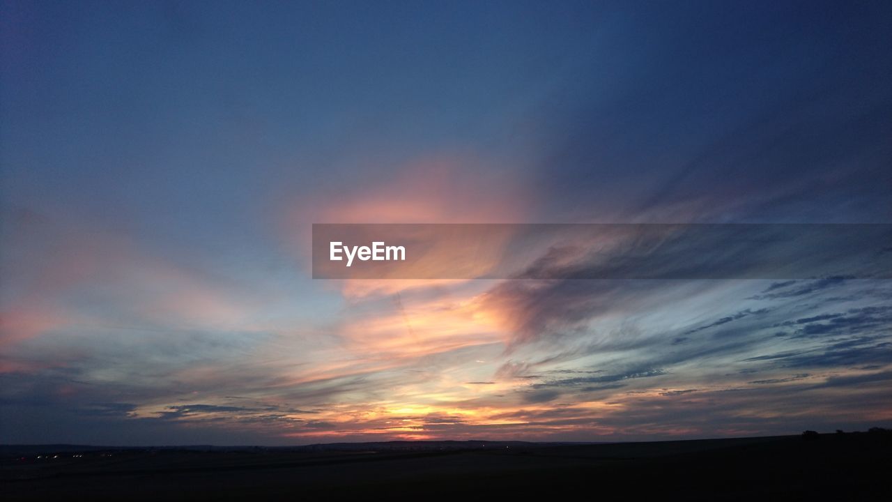 SILHOUETTE LANDSCAPE AGAINST SKY DURING SUNSET