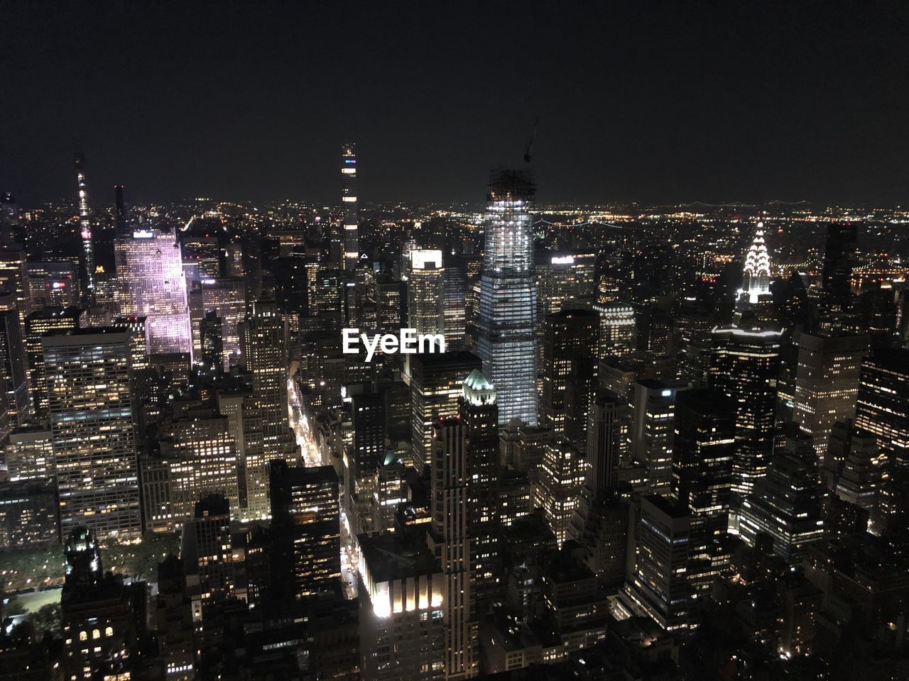 Illuminated buildings in city at night